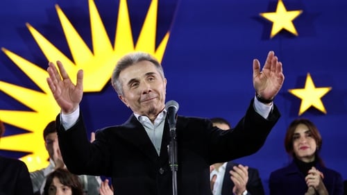 Founder of the ruling Georgian Dream party Bidzina Ivanishvili gives a speech during a gathering at the party's headquarters after exit polls were announced