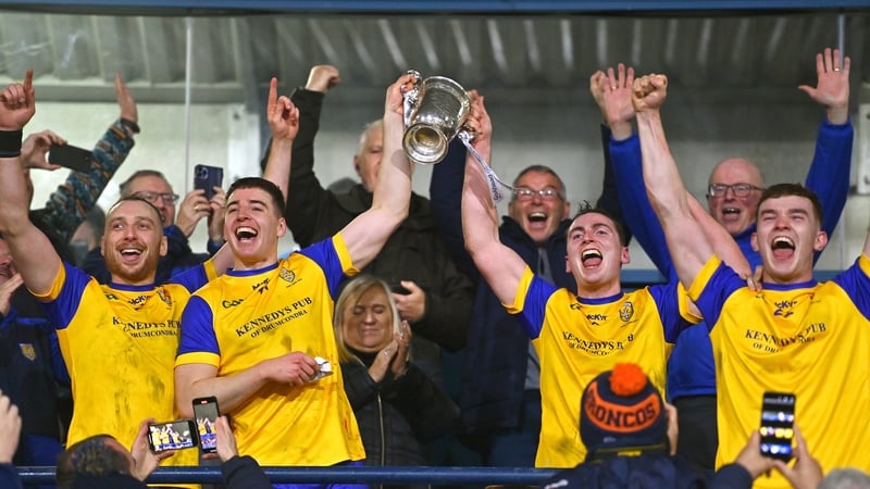 Na Fianna captain Donal Burke, left, and teammate Peter Feeney lift the cup