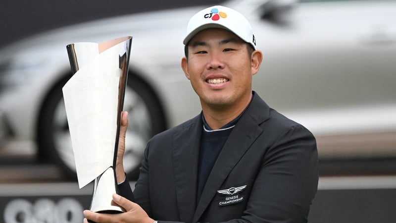 Byeong-hun An with the Genesis Championship trophy