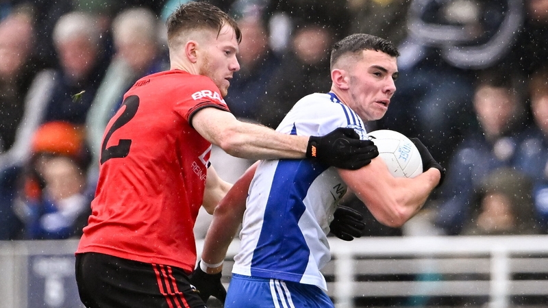 Eoin Lawlor of Naas in action against Celbridge's Tony Archbold