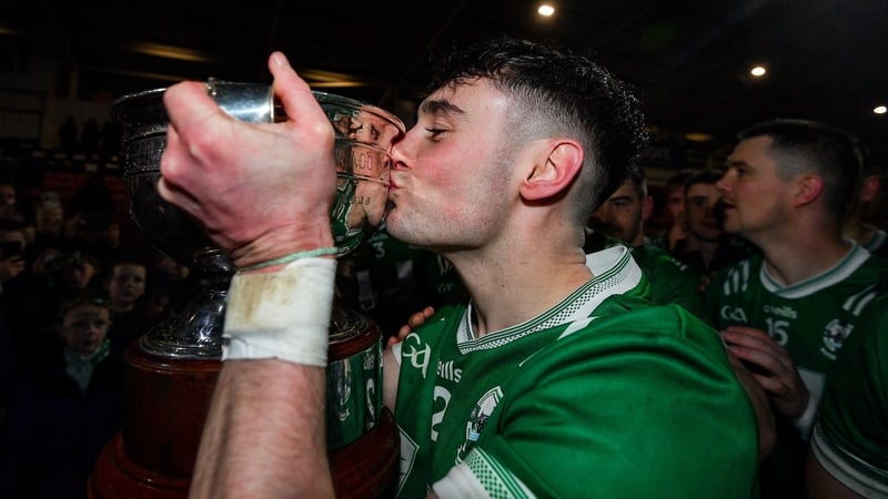 Newbridge captain Conor McAteer kisses the trophy after the game