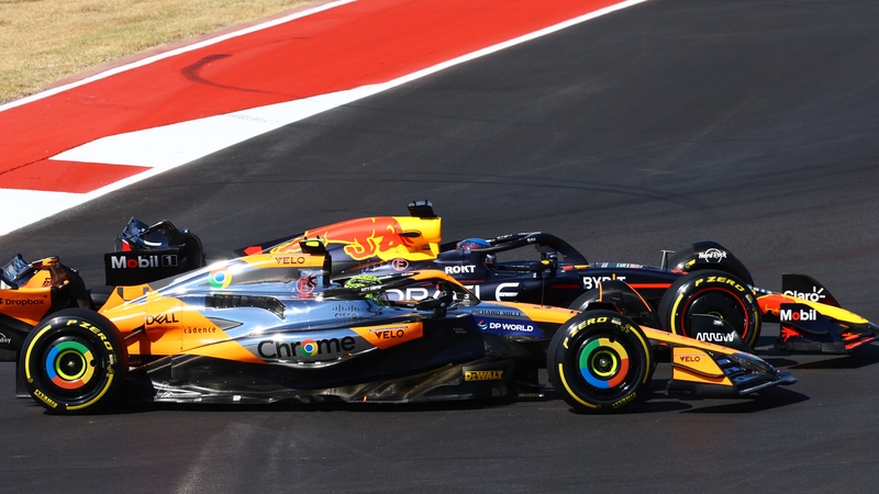 Lando Norris, inside, and Max Verstappen battle for position