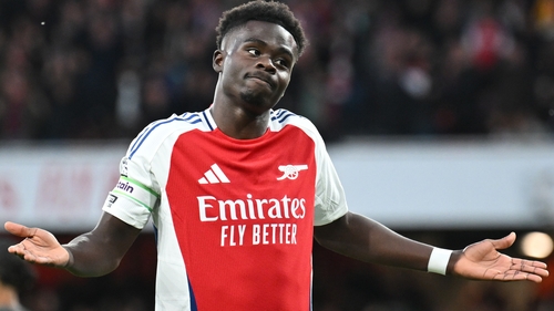 Saka salutes his opening goal on Sunday