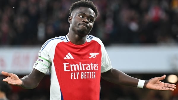 Saka salutes his opening goal on Sunday