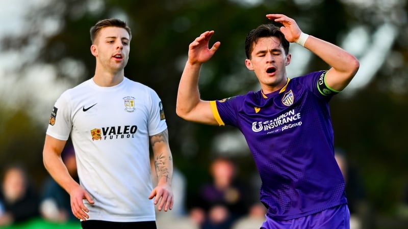 Wexford captain Aaron Dobbs (right) reacts to a missed chance