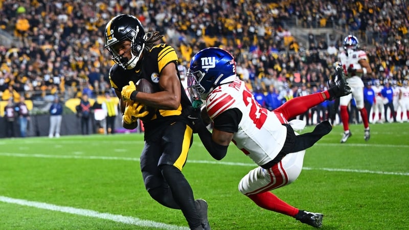 Calvin Austin III scores a touchdown against Dru Phillips of the New York Giants