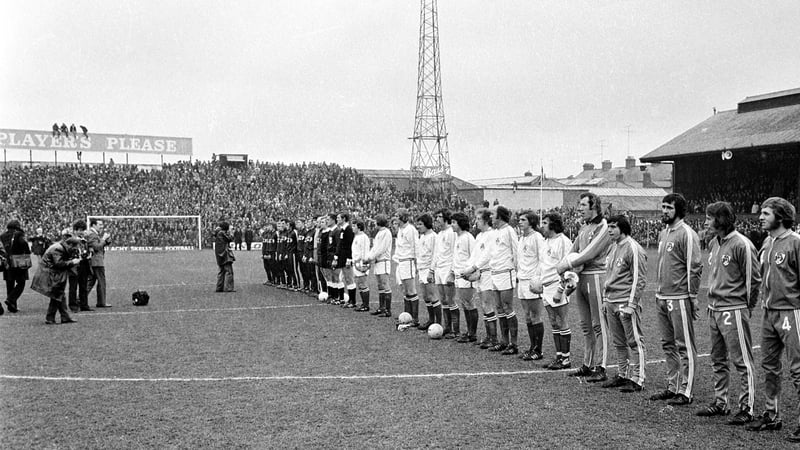 Republic of Ireland and USSR players line up for the national anthems