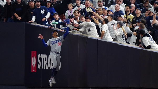 Gleyber Torres was given out after a fan in a Yankees top took the ball from the glove of Dodgers outfielder Mookie Betts