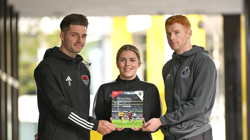League of Ireland players, including Cork CIty's Ruairí Keating (L), Laurie Ryan (C) of Athlone Town and Rory Gaffney of Shamrock Rovers, attended the publication of the report in Dublin