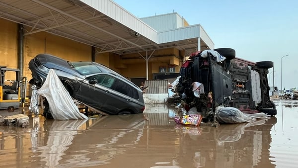 Vehicles are upended after flash floods and heavy rain in Valencia, Spain