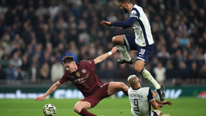 Jacob Wright of City goes down after being challenged by Rodrigo Bentancur and Richarlison of Spurs