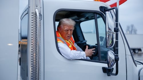 The former US president took questions as he sat inside a garbage truck which called attention to earlier comments made by Joe Biden