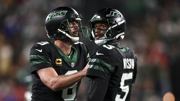 Aaron Rodgers celebrates with Garrett Wilson after a touchdown during the second half