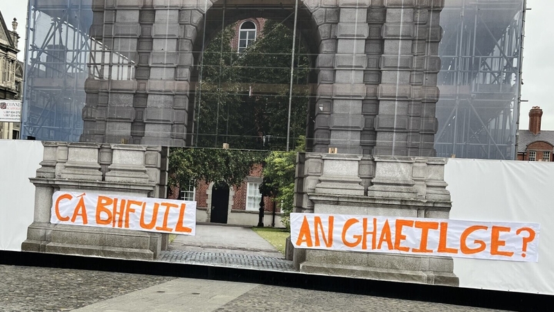 Trinity College's Students' Union has hung a banner across scaffolding surrounding the college's Campanile tower