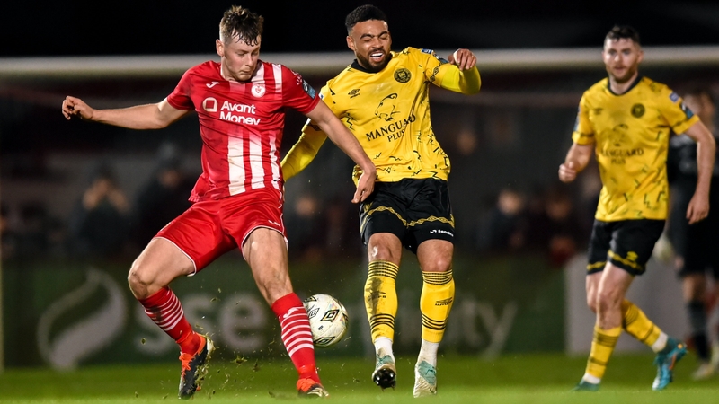 Jake Mulraney of St Pat's is tackled by Sligo's Ollie Denham