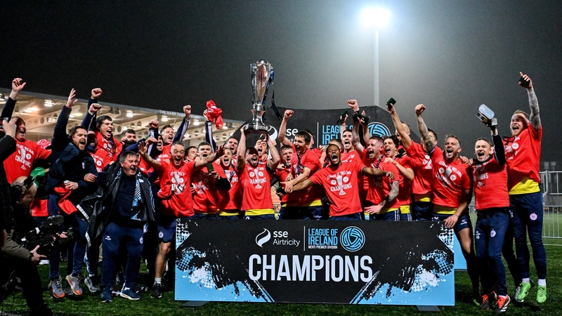 Shelbourne celebrate with the trophy after the victory in Derry