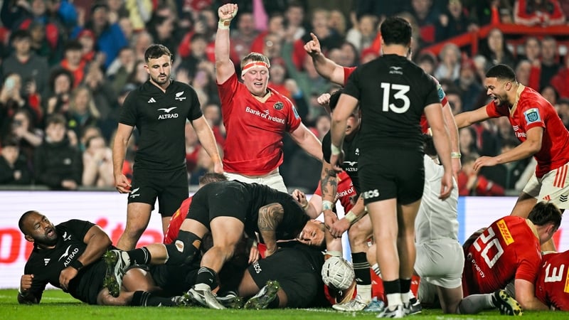 Munster celebrate one of their four tries