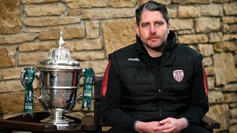 Ruaidhrí Higgins posing with the trophy he won in 2022