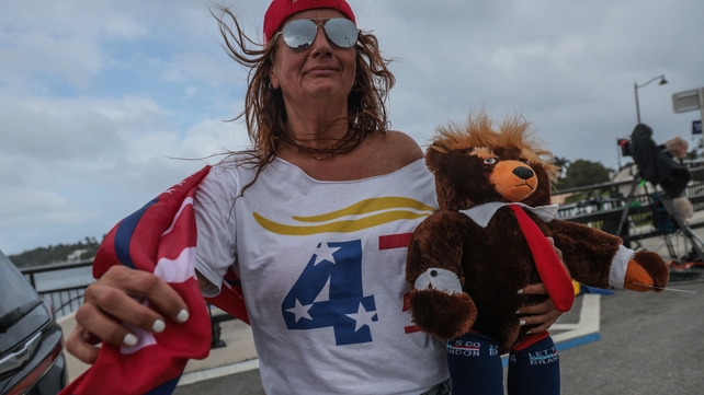 Supporters of Donald Trump show their support near his residence in Mar A Lago