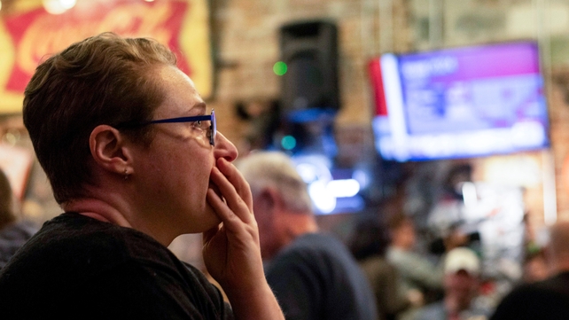 An attendee looks on with shock at an election night watch party in Atlanta, Georgia
