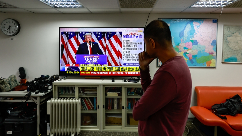 A television broadcasting Donald Trump giving his victory speech is watched in Taiwan
