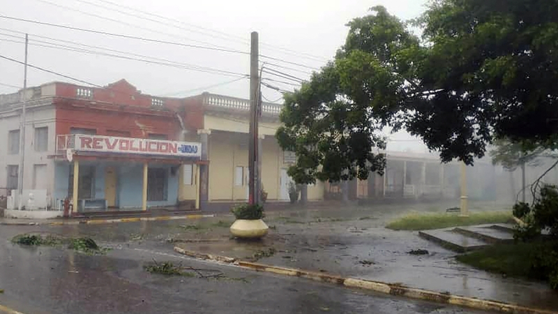 Broken tree branches are seen on a street after the landfall of Hurricane Rafael in Pueblo Candelaria, Artemisa Province, 65 km west of Havana