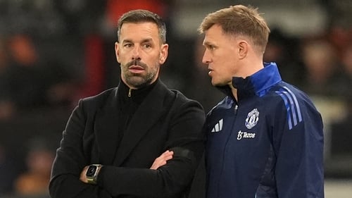 Manchester United interim manager Ruud van Nistelrooy (L)and coach Darren Fletcher