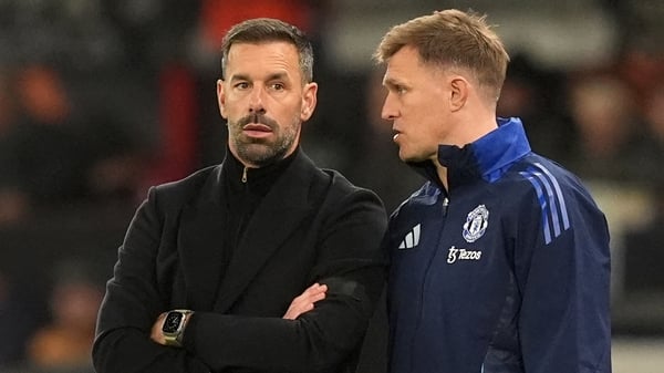 Manchester United interim manager Ruud van Nistelrooy (L)and coach Darren Fletcher