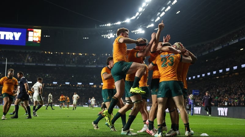 The Australian players celebrate Max Jorgensen's late winning try