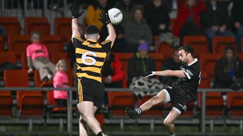Substitute Conor Laverty kicks a point for Kilcoo
