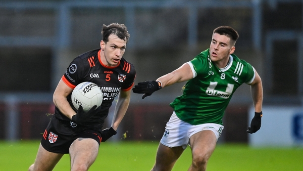 Barry McCambridge of Clann Éireann in action against Conor Doherty of Newbridge