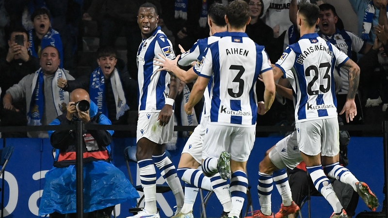 Real Sociedad forward Sheraldo Becker (L) celebrates with team-mates after scoring his team's winner