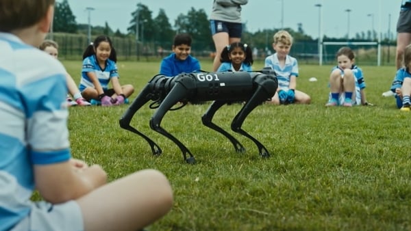 Megabyte the robot dog plays with the kids at Athlone GAA.