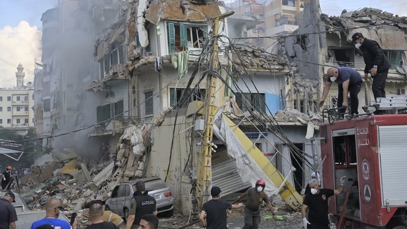 Firefighters and rescue teams arrive at scene following an Israeli attack on Dahieh region in Beirut