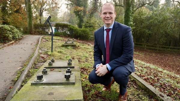 NI Communities Minister Gordon Lyons at barrage balloon anchors on the Stormont Estate