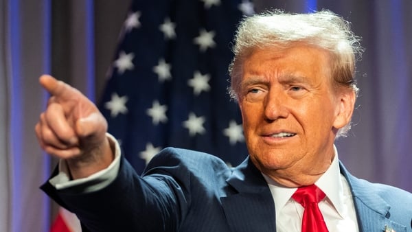 Donald Trump gestures while speaking during a meeting with House Republicans today