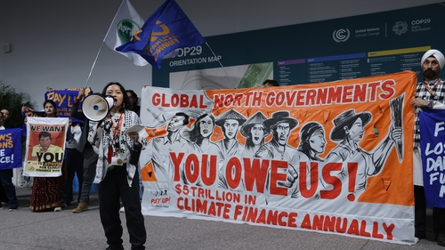 Activists demand climate change loss and damage financing from rich countries at the UNFCCC COP29 Climate Conference in Baku