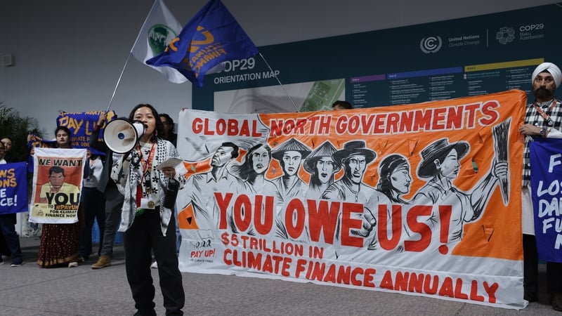 Activists demand climate change loss and damage financing from rich countries at the UNFCCC COP29 Climate Conference in Baku