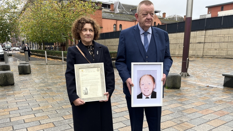 Billy McGreaney's niece and nephew - Marjorie Roddy and Billy McGreanery - hold a picture of their uncle and the letter of apology they received from MoD