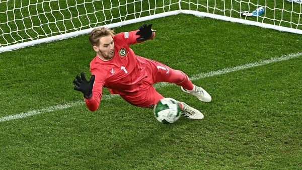 Caoimhín Kelleher dives to deny Finland's penalty from Joel Pohjanpalo
