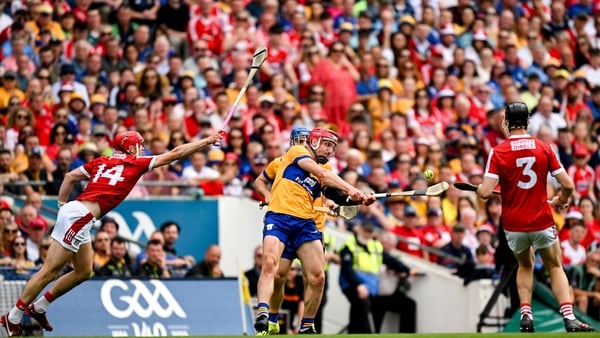 John Conlon of Clare in action against Alan Connolly (14) of Cork during this year's hurling decider