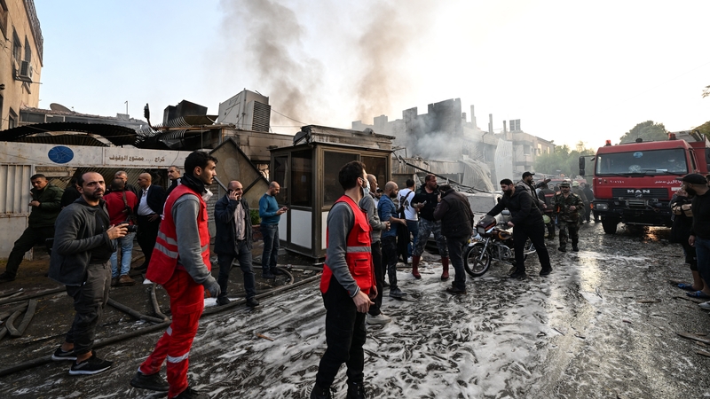 Yesterday, people check the damage following a reported Israeli strike in the Mazzeh district of Damascus