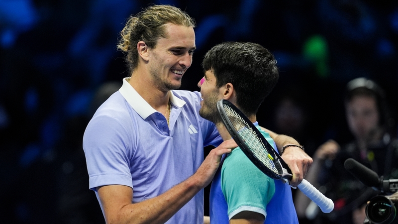 Alexander Zverev embraces Carlos Alcaraz after his win in Turin