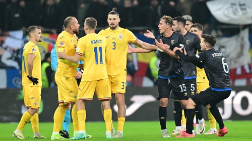 Kosovo and Romania players argue before leaving the pitch