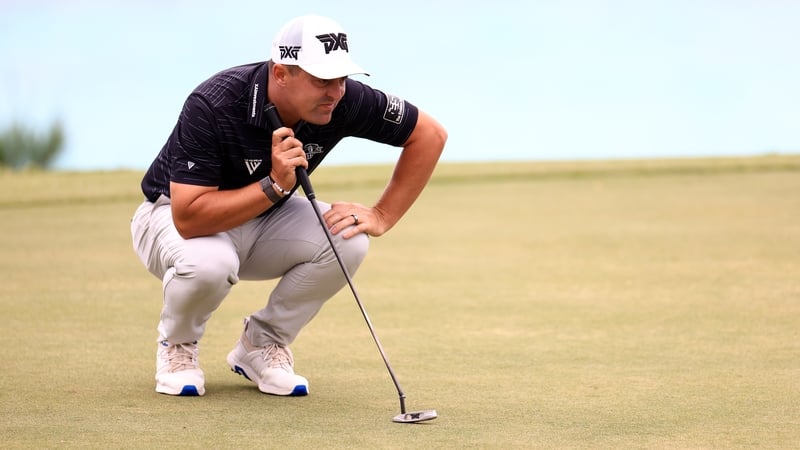 Justin Lower lining up a putt on the 16th