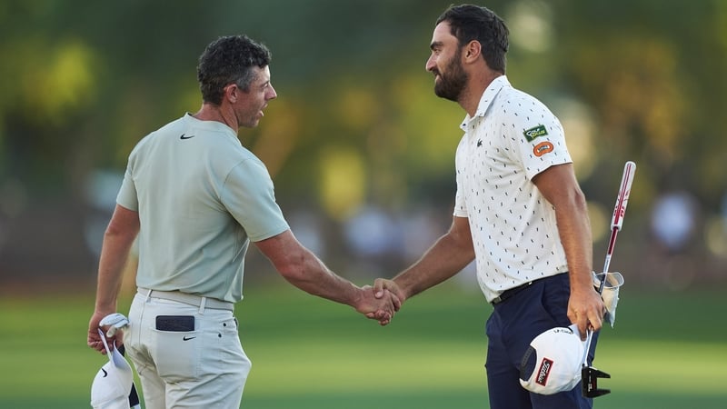 Rory McIlroy and Antoine Rozner shake hands after the third round