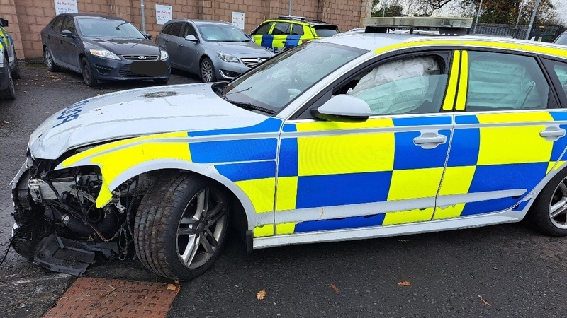 A view of the damaged PSNI vehicle are two men collided with it during a car chase in Belfast