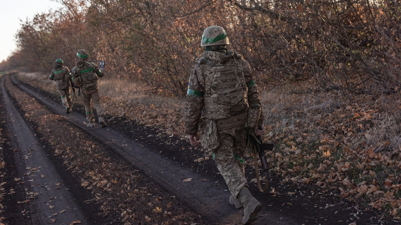Ukrainian soldiers walk towards their fighting position, in the direction of Toretsk as Russia-Ukraine war continues in Donetsk Oblast, Ukraine