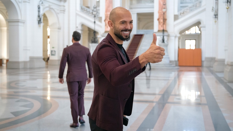 Andrew Tate posing for a photo at a previous court hearing
