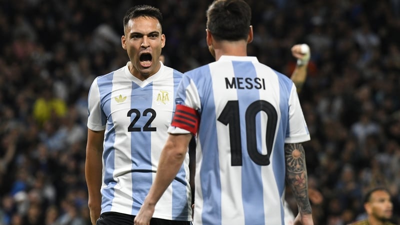 Lautaro Martinez celebrates with Lionel Messi as Argentina beat Peru
